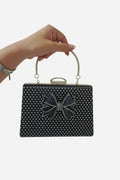 Pochette de soirée noire à nœud et strass avec bandoulière chaîne